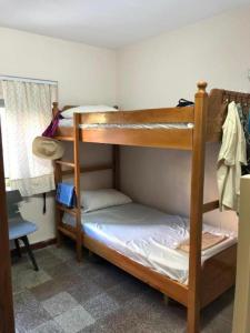 a bedroom with two bunk beds in a room at Enjoy Hostel in Tirana +7 photos