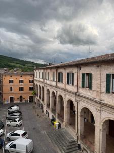 a group of cars parked in a parking lot at Hotel Appennino in Sassoferrato +2 photos