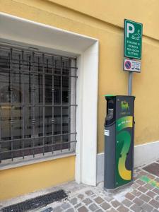a trash can sitting in front of a building at Hotel Appennino in Sassoferrato