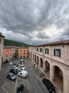 a group of cars parked in a parking lot at Hotel Appennino in Sassoferrato