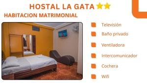 a picture of a hotel room with a bed and a mirror at Hostal La Gata in Tingo María