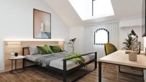 a bedroom with a bed with green pillows and a table at Stari Grad in Kragujevac