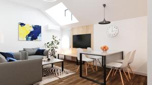 a living room with a table and a couch at Stari Grad in Kragujevac