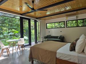 a bedroom with a bed and a ceiling fan at Fauna Lodge in Drake +48 photos