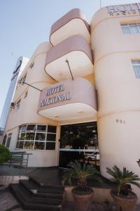a hotel malibu international building with stairs in front at Hotel Nacional Service - Fácil acesso a Região da 44 e Rodoviária in Goiânia