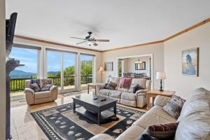 a living room with a couch and a table at Elderberry Escape in Beech Mountain