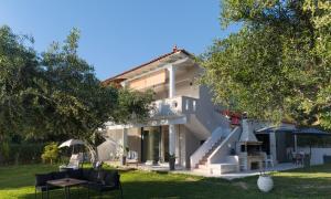 a villa with a view of the house at Blue Residences in Paralia Vrachou