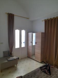 a living room with a door and a couch and a window at Taguermess Tag 6 in Taguermess