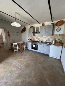a kitchen with a table and a counter top at Da Lucia in Francavilla al Mare