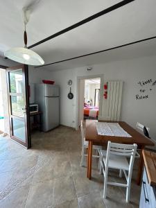 a kitchen and dining room with a table and chairs at Da Lucia in Francavilla al Mare +42 photos