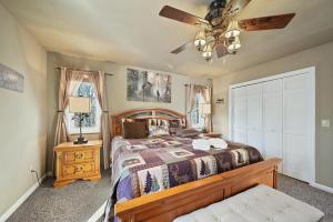 a bedroom with a bed and a ceiling fan at Four Diamond Escape in Seven Devils