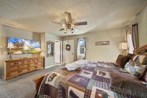 a bedroom with a bed and a ceiling fan at Four Diamond Escape in Seven Devils +34 photos