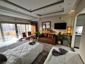 a hotel room with two beds and a television at tourist hotel cairo downtown in Cairo