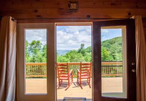 a view from the front door of a cabin at High Road Cabin in Banner Elk