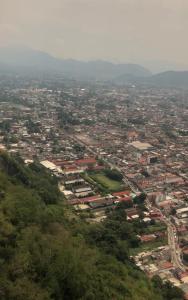 an aerial view of a city with houses and trees at Casa Flores in Río Blanco
