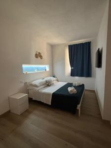 a bedroom with a bed and a window at Agriturismo Adenzia in Porto Empedocle +59 photos
