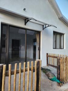 a peacock standing in front of a house at Mon Desir Estate - NR3 in Pietermaritzburg +4 photos