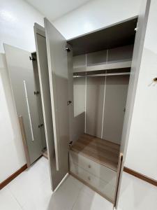a walk in closet with two closets in a room at Happy day in Nong Prue