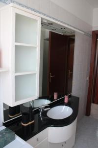 a bathroom with a sink and a mirror at nido delle farfalle in Stazione di Chiusi +20 photos
