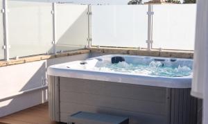 a jacuzzi tub in a room with water at Vira Verso Est in Otranto +86 photos
