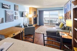 a living room with a couch and a table at Lovely Oceanfront Condo -Top Floor - Pet Friendly in Lincoln City +24 photos