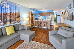 a living room with a couch and a kitchen at Lovely Oceanfront Condo -Top Floor - Pet Friendly in Lincoln City