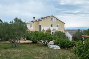 a large house with trees in front of it at Blagdan Holiday in Kukljica