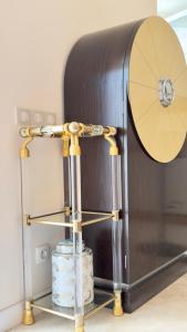 a drum on a stand next to a table at Monaco 2bdr luxury apartment, private garden&pool in Beausoleil +44 photos