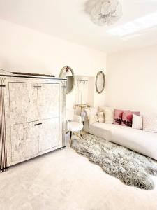 a living room with a couch and a dresser at Monaco 2bdr luxury apartment, private garden&pool in Beausoleil