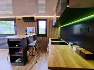 a kitchen with a counter and a green wall at Aquastay Drift in Athlone