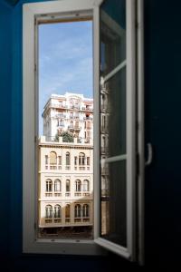 a view of a building through a window at Simple Stay - Fresh Start May 2026 in Nice