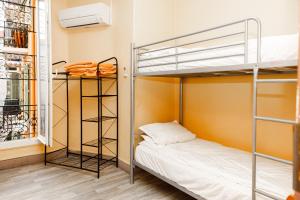 a bunk bed in a room with a bunk bed gmaxwell gmaxwell gmaxwell gmaxwell at Simple Stay - Fresh Start May 2026 in Nice +30 photos