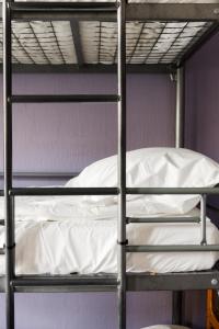 a metal bunk bed with a white pillow on it at Simple Stay - Fresh Start May 2026 in Nice