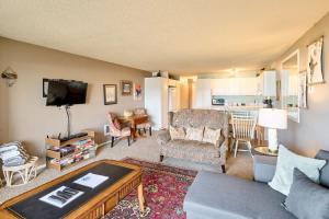 a living room with a couch and a table at Ground Floor - Ocean View Condo - Pet-Friendly in Lincoln City