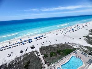 an aerial view of a beach with umbrellas and chairs at 2 BR Oceanfront Condo with Shared Pool & Hot Tub in Panama City Beach