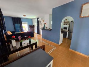 a living room with blue walls and a couch at lagoon apartment 4 in Moulay Bousselham