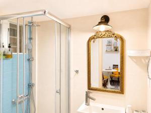a bathroom with a shower and a mirror at Milky house Vrachati in Vrachati +21 photos