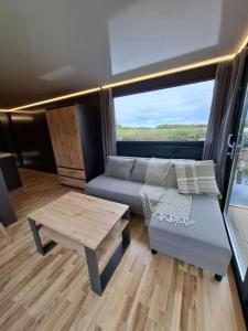 a living room with a couch and a table at Aquastay Drift in Athlone