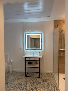 a bathroom with a sink and a mirror at Sorolla Urban Suites in Valencia +103 photos