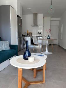 a living room with a couch and a table at Modern Studio Lamar Resort in Pilar de la Horadada