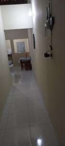 a hallway with a room with a table and a light at Casa de Lagoa Nova in Martins