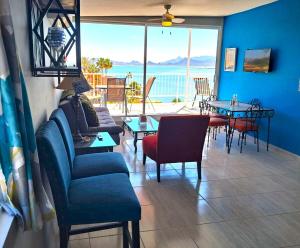 a living room with a view of the ocean at Stunning Azul Ocean View Apartment in San Carlos +18 photos