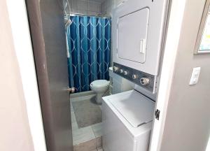 a small bathroom with a toilet and a sink at Stunning Azul Ocean View Apartment in San Carlos