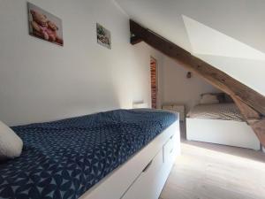 a bedroom with a bed and a bedvisor at Ty Noa - 2-bedroom cottage in Saint-Just