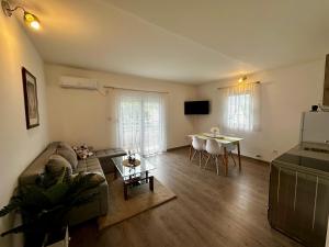 a living room with a couch and a table at Liberty Apartments in Cetinje