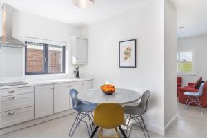 a kitchen with a table with a bowl of fruit on it at Gorgeous Luxury in Lahinch
