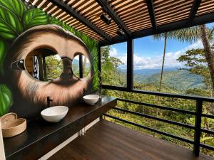 a bathroom with two sinks and a mural of a monkey at Private Luxury A-Frame with Jacuzzi & Mountain View in San Francisco