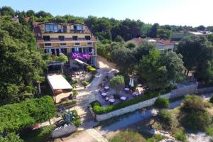 an aerial view of a building with a garden at Rooms Figarola in Rovinj