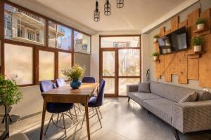 a living room with a couch and a table at Guest House Nikala in Mestia