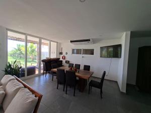 a living room with a couch and a table and chairs at Venice House, Costa del Sol in San Luis La Herradura